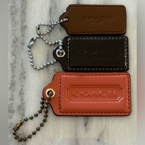 Coach Trio Leather Hangtag Set in Salmon Pink, Dark Brown and Camel - Picture 1 of 5